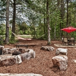 custom built homes outdoor living area fireplace