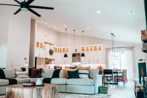 Open-concept living room with vaulted ceiling, sectional seating, and expansive gathering space.